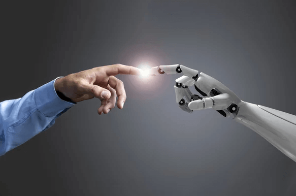 Human and robot fingers meeting and touching at the fingertips